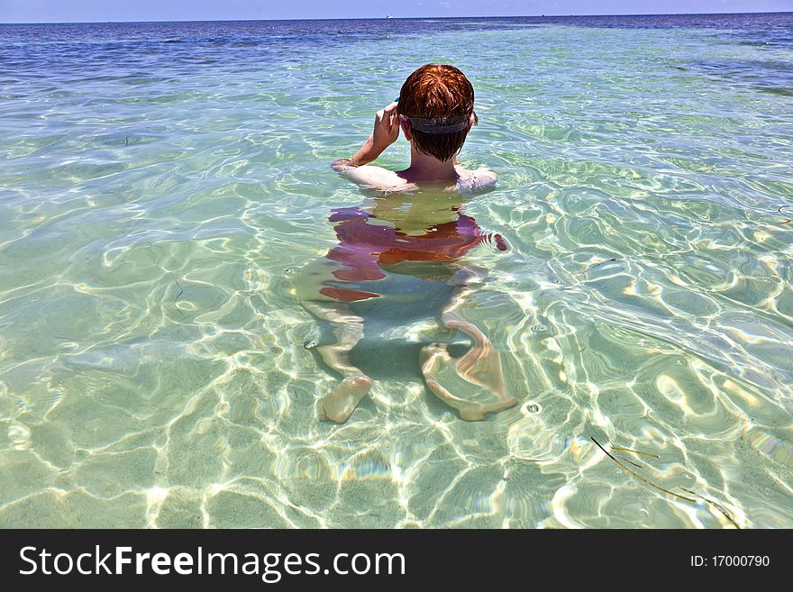 Boy with red hair loves to dive in the ocean. Boy with red hair loves to dive in the ocean