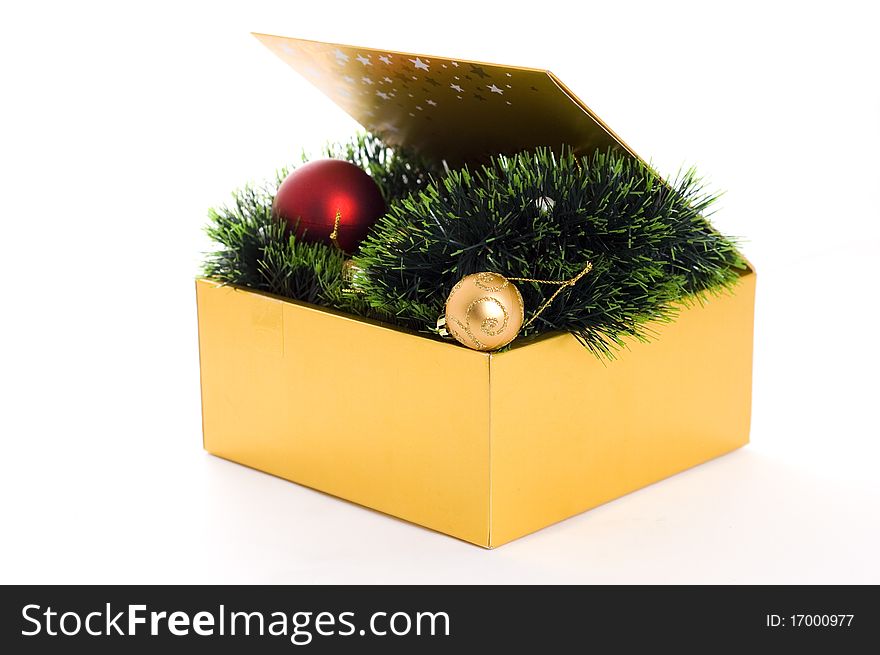 Golden box with christmas balls isolated on white background. Golden box with christmas balls isolated on white background