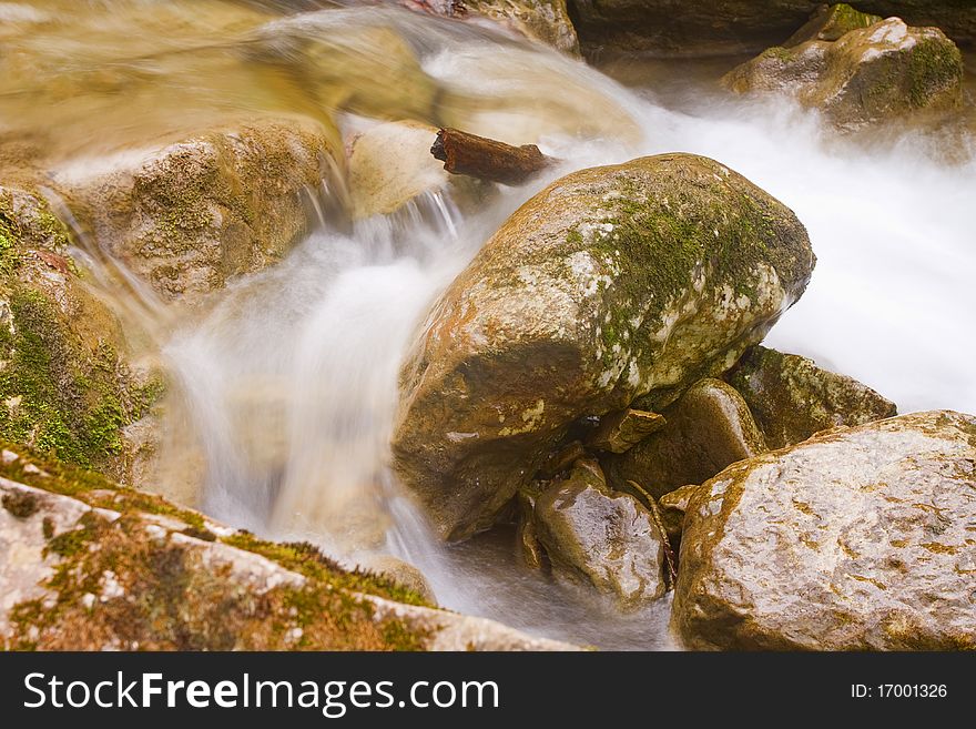 Closeup view of pebble and stream