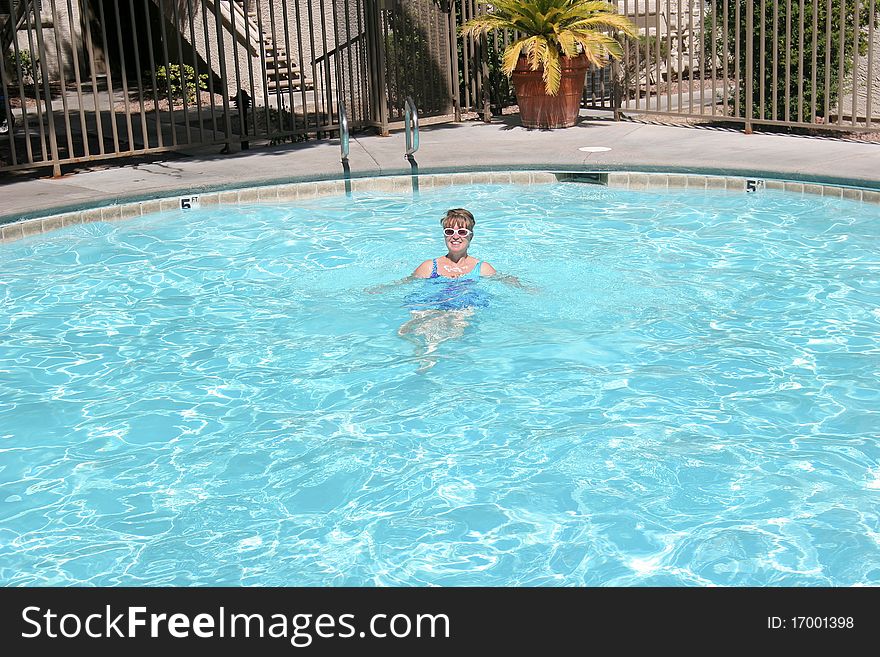 Enjoying a refreshing moment in the swimming pool. Enjoying a refreshing moment in the swimming pool.