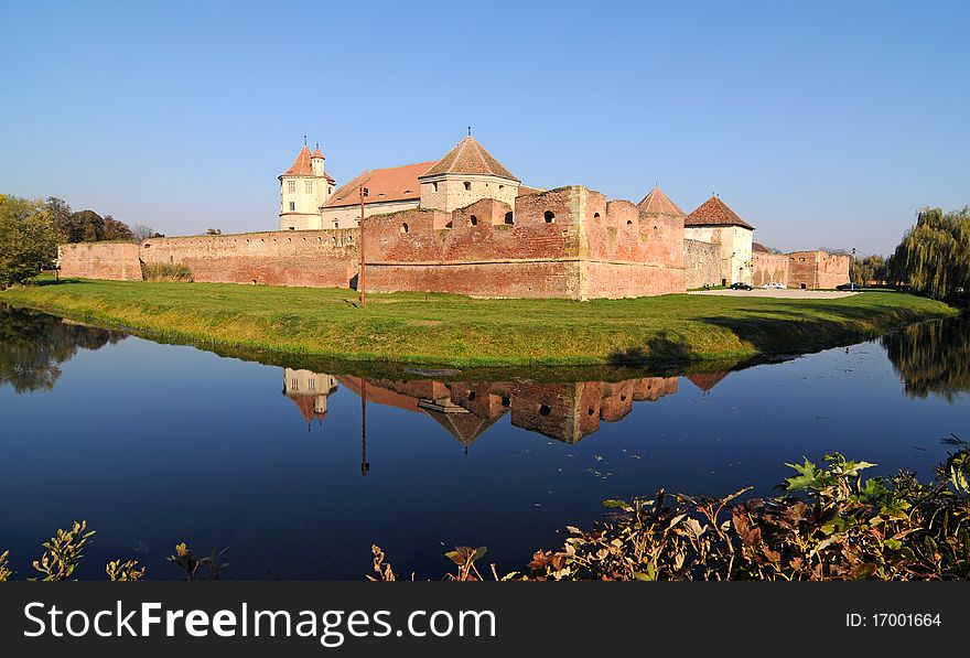 Medieval castle and it's water reflection, Fagaras, Romania