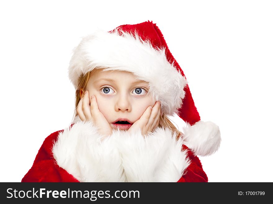 Small girl dressed as santa claus looks surprised