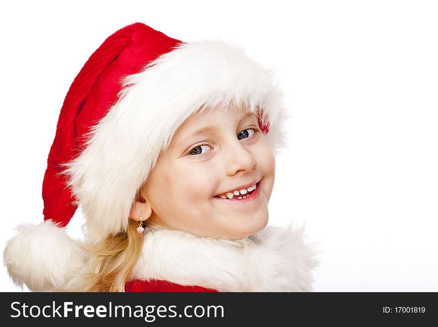 Small girl dressed as santa claus smiles happy into camera. Isolated on white background. Small girl dressed as santa claus smiles happy into camera. Isolated on white background.