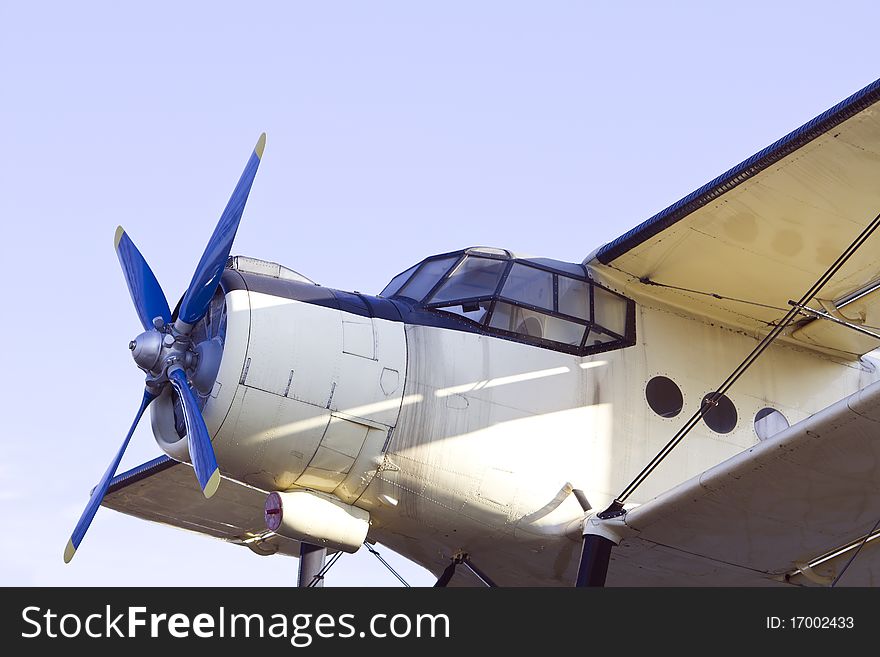 Closeup of vintage biplane with blue propeller. Closeup of vintage biplane with blue propeller.
