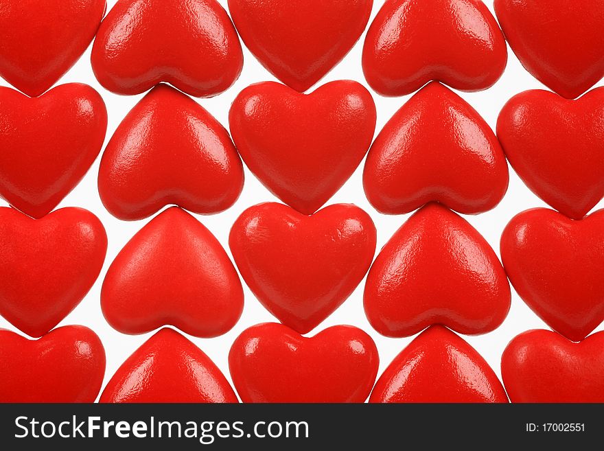Abstract picture from red hearts on a white background