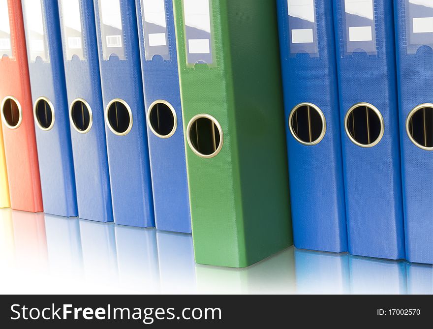 Ring binders in row and reflection