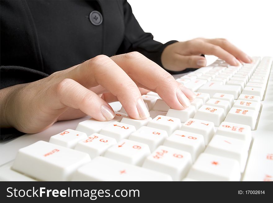 Girls hands on the computer keyboard Isolated on white