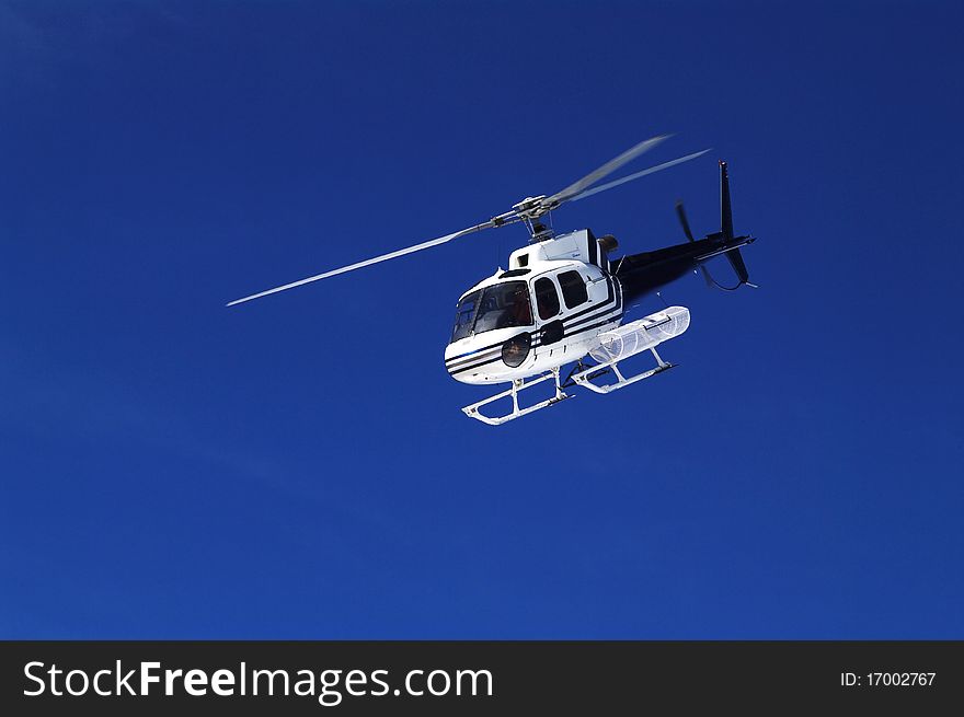 Approaching emergency helicopter in skiing area. Approaching emergency helicopter in skiing area