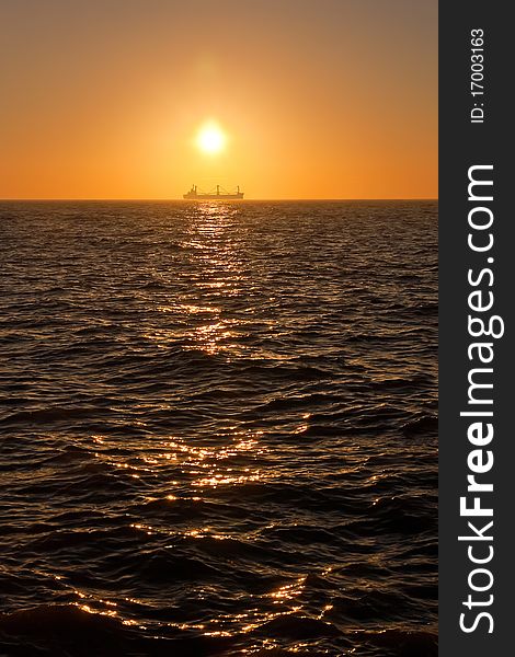 Sunrise in the sea. Ship on the background. Sunrise in the sea. Ship on the background.