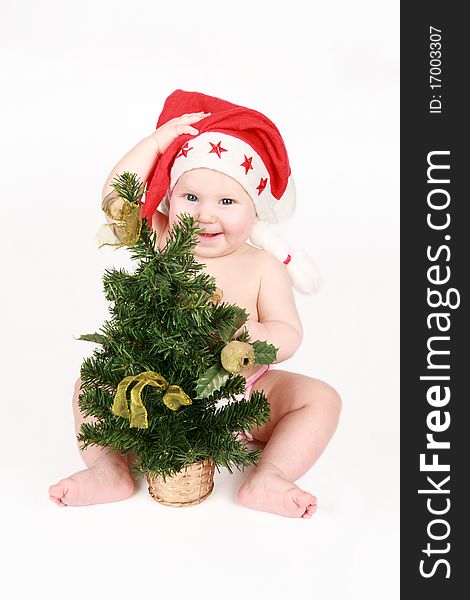 The happy gnome with a Christmas fur-tree on a white background