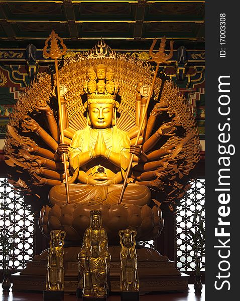 Thousand hands golden Buddha in dragon temple,Thailand