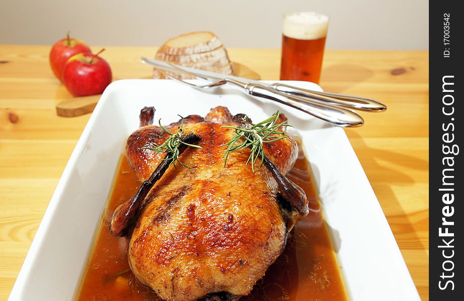 Food styling of baked duck with rosemary