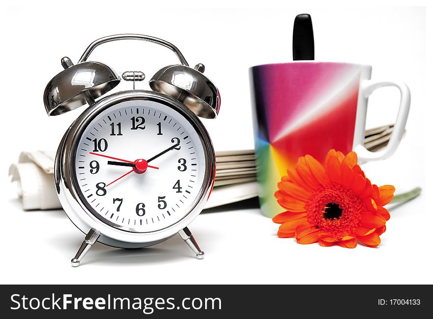 Newspaper, clock, cup of coffee and red daisy on white background. Newspaper, clock, cup of coffee and red daisy on white background