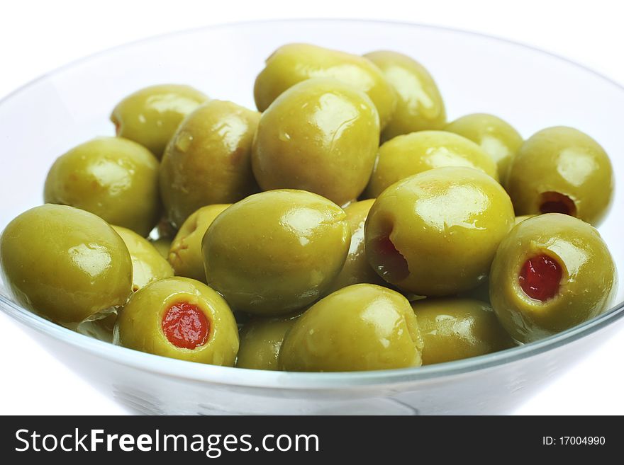 Green olives on white background