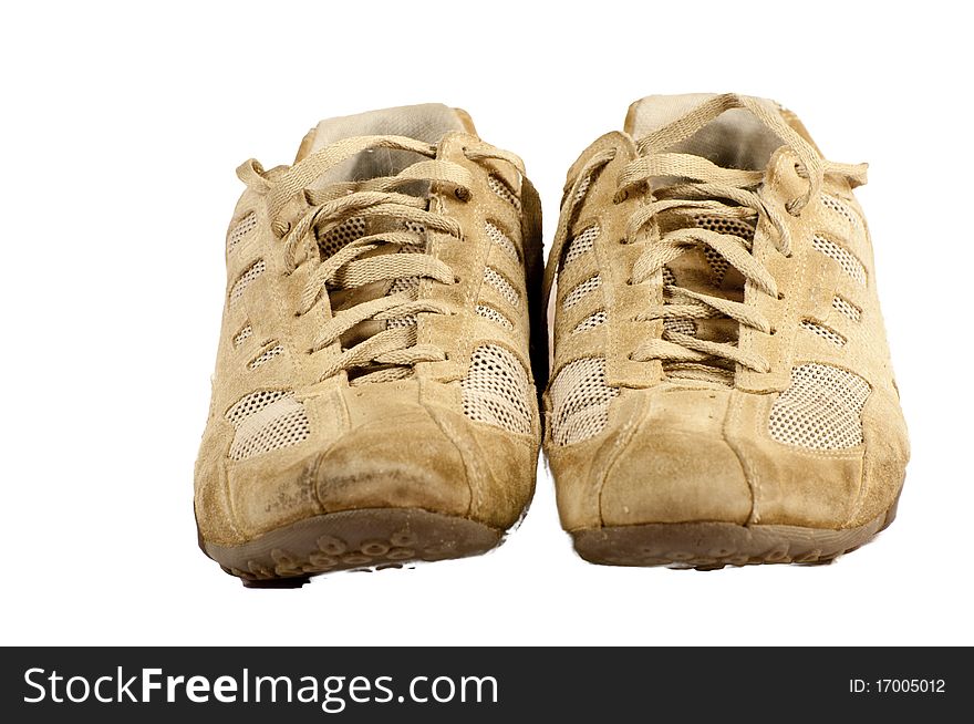 Pair of old sneakers isolated on a white background