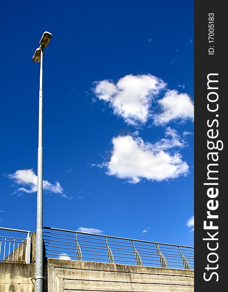 High lamp with blue sky and white clouds. High lamp with blue sky and white clouds