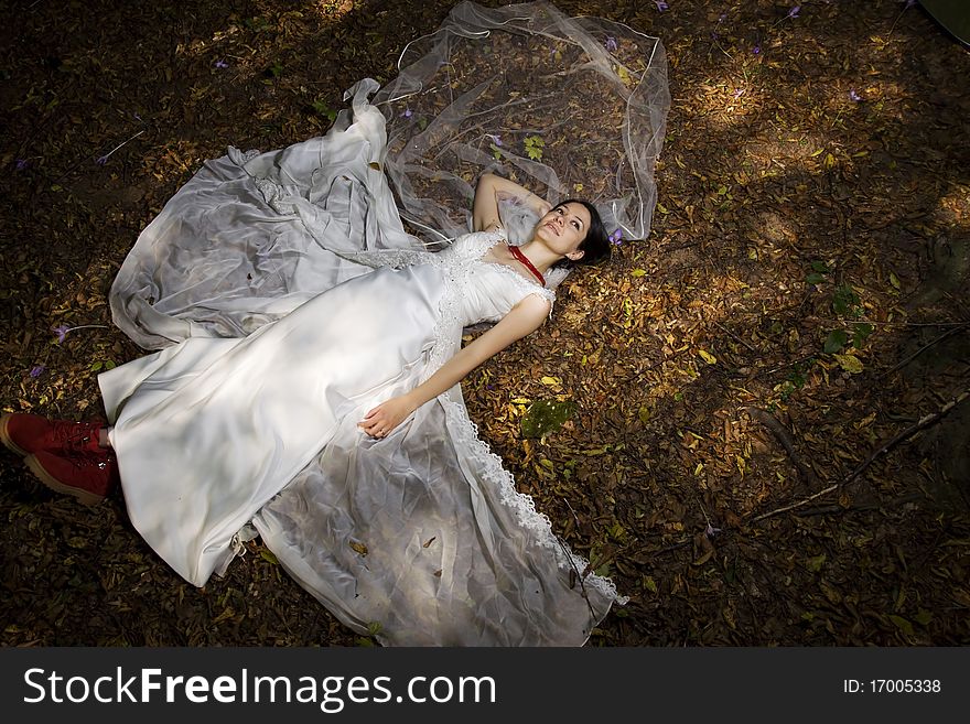 Trash the dress in autumn forest