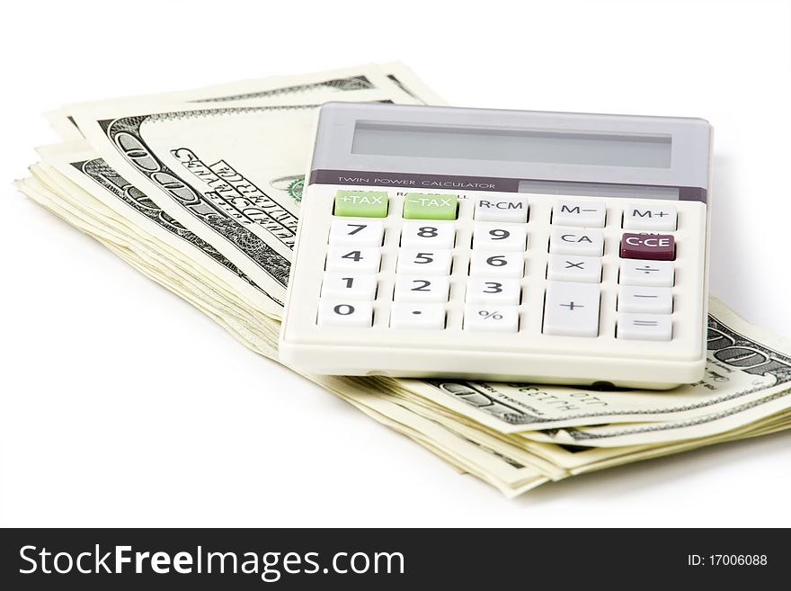 Business concept. Dollars; calculator on white background