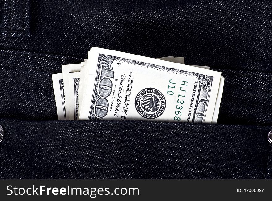 Dollars in black jeans pocket