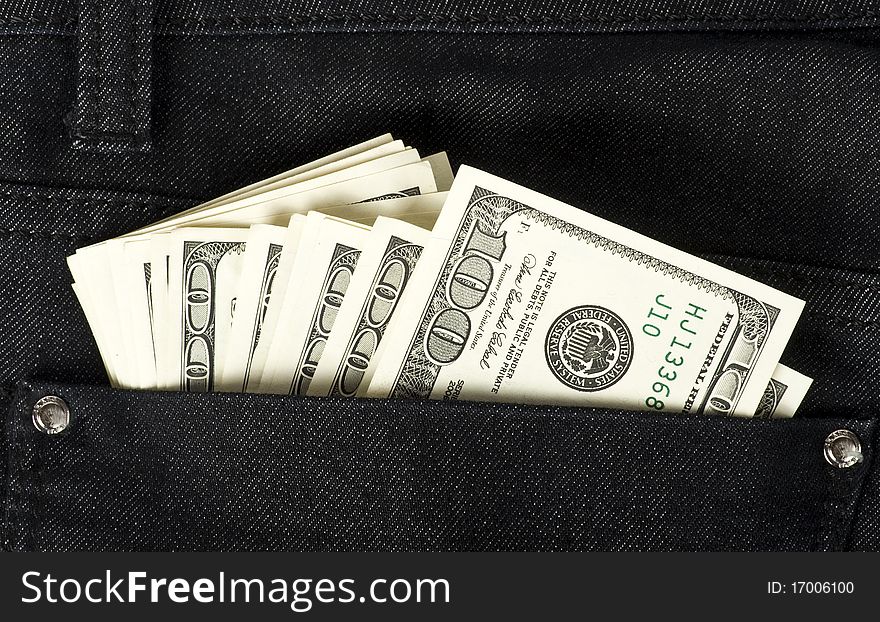 Dollars in black jeans pocket