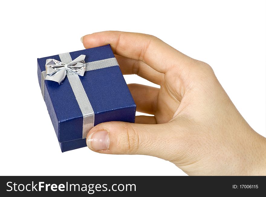 Small dark blue gift in a female hand. Small dark blue gift in a female hand