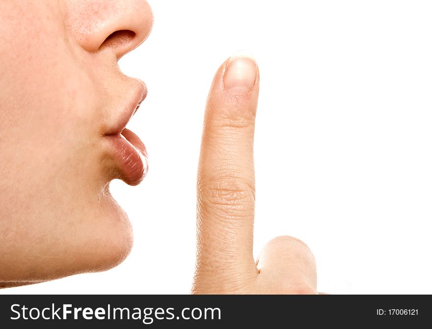 Woman with a finger on her lips