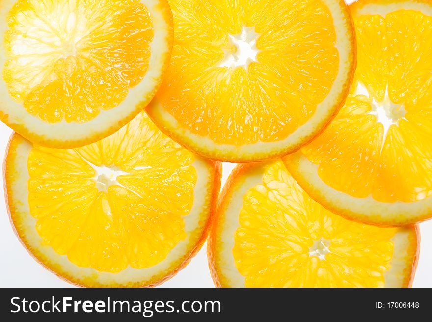 Slices of an orange with white background. Slices of an orange with white background.