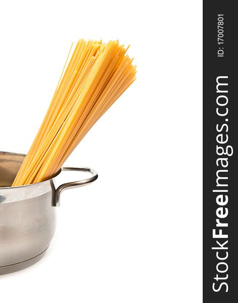 Closeup of spaghetti and pan on white background with clipping path. Closeup of spaghetti and pan on white background with clipping path
