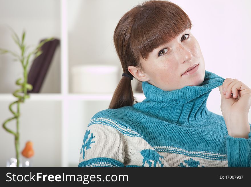 Woman in knit jumper, sweater relaxing at home