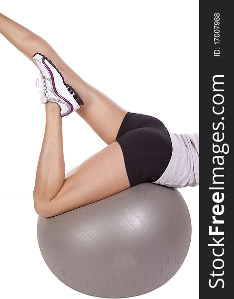 A close up of a womans legs up on a exercise ball. A close up of a womans legs up on a exercise ball.