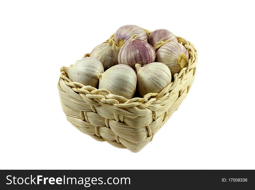 Garlic in basket on white background