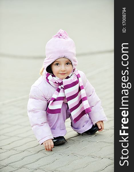 Girl drawing on sidewalk. little city girl