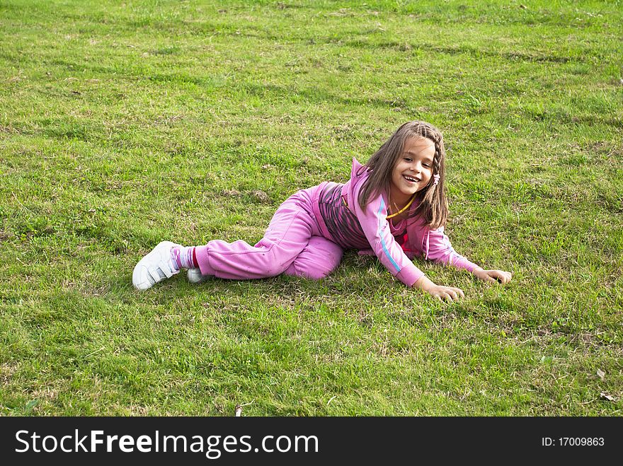 Little girl enjoy playing on grass. Little girl enjoy playing on grass