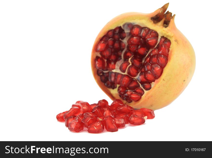 Pomegranate with seed on white background