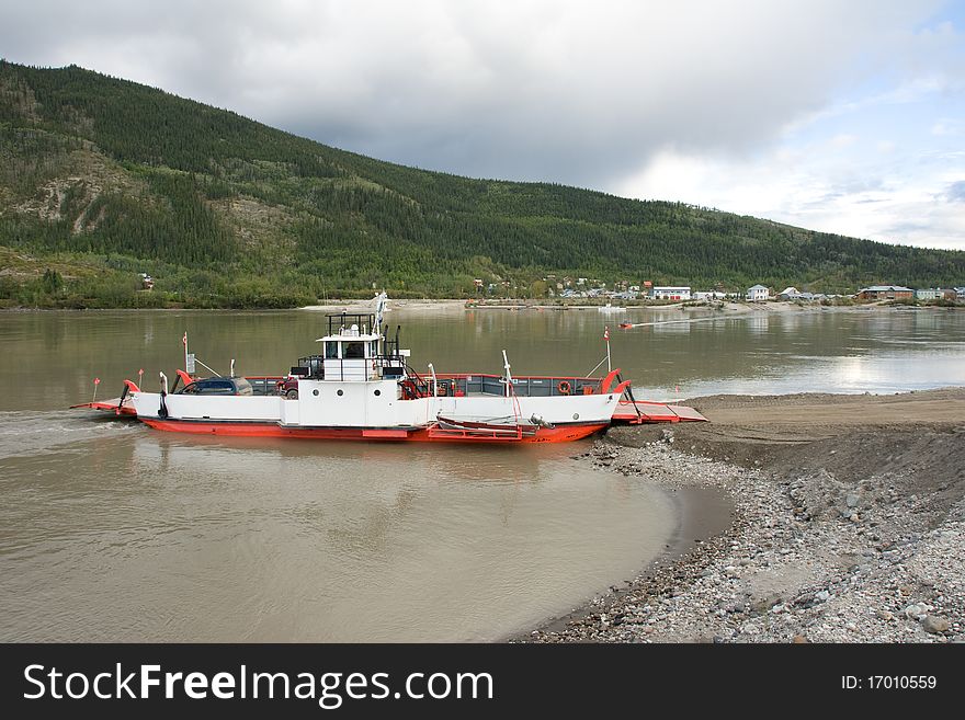 A ferry crosses the Yukon River near Dawson City for the Top of the World Highway. A ferry crosses the Yukon River near Dawson City for the Top of the World Highway
