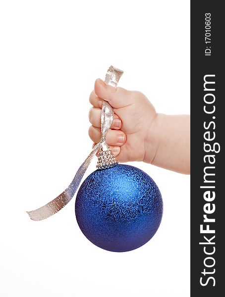 Baby hand with blue christmas bauble on a white background