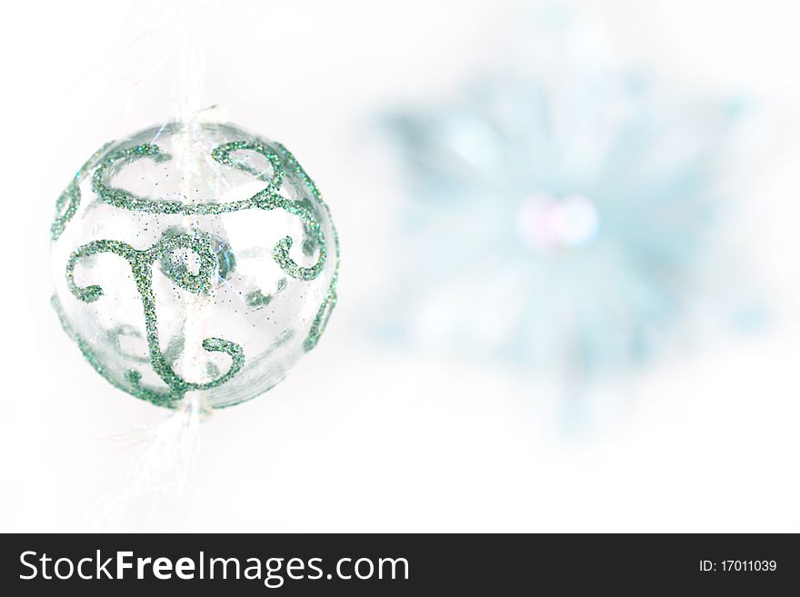 Transparent christmas ball with bluring snowflake