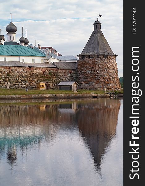 Old round stone tower in Solovetsky monastery with blue sky background, Karelia, Russian Federation. Old round stone tower in Solovetsky monastery with blue sky background, Karelia, Russian Federation.