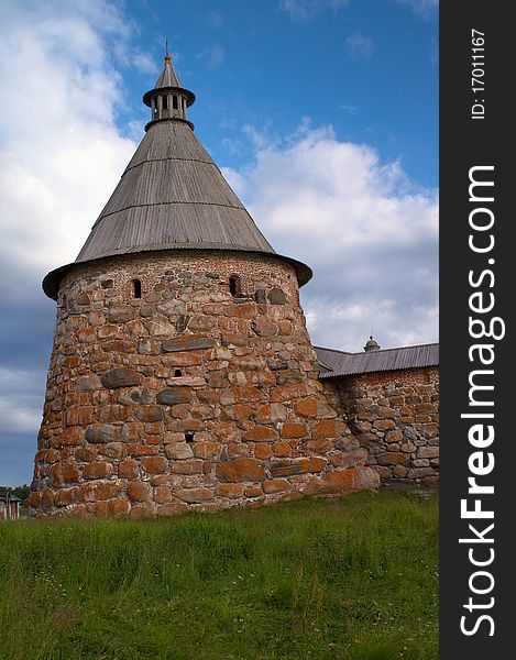 Old round stone tower in Solovetsky monastery with blue sky background, Karelia, Russian Federation. Old round stone tower in Solovetsky monastery with blue sky background, Karelia, Russian Federation.