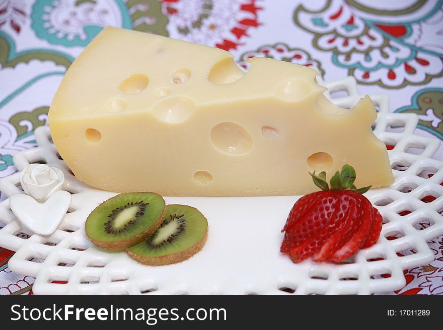 A slice of Swiss cheese with fruit