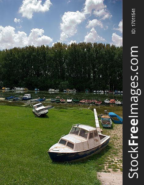 Flooded river and floating boats. Flooded river and floating boats