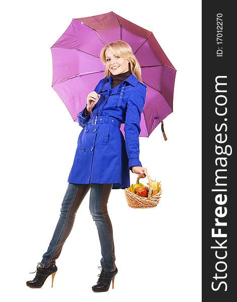 Cheerful girl with a bascket of fruit and umbrella, white backgrouna. Cheerful girl with a bascket of fruit and umbrella, white backgrouna