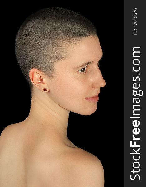 Portrait of shaved girl isolated on black