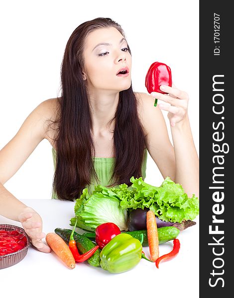 Young girl with  vegetables over white background