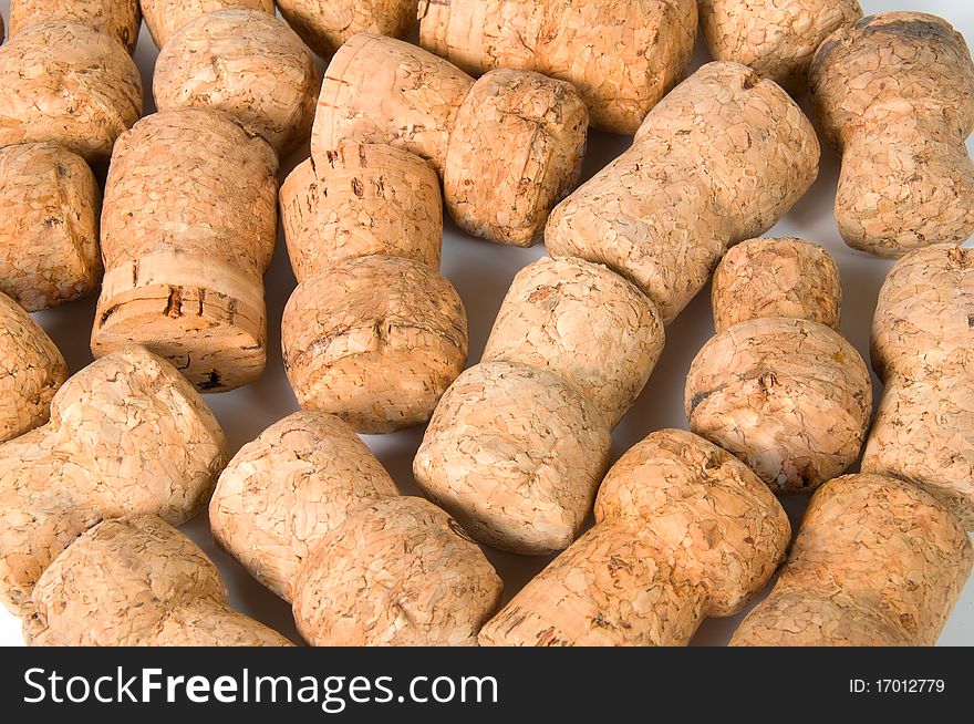 Pile of corks on a white background
