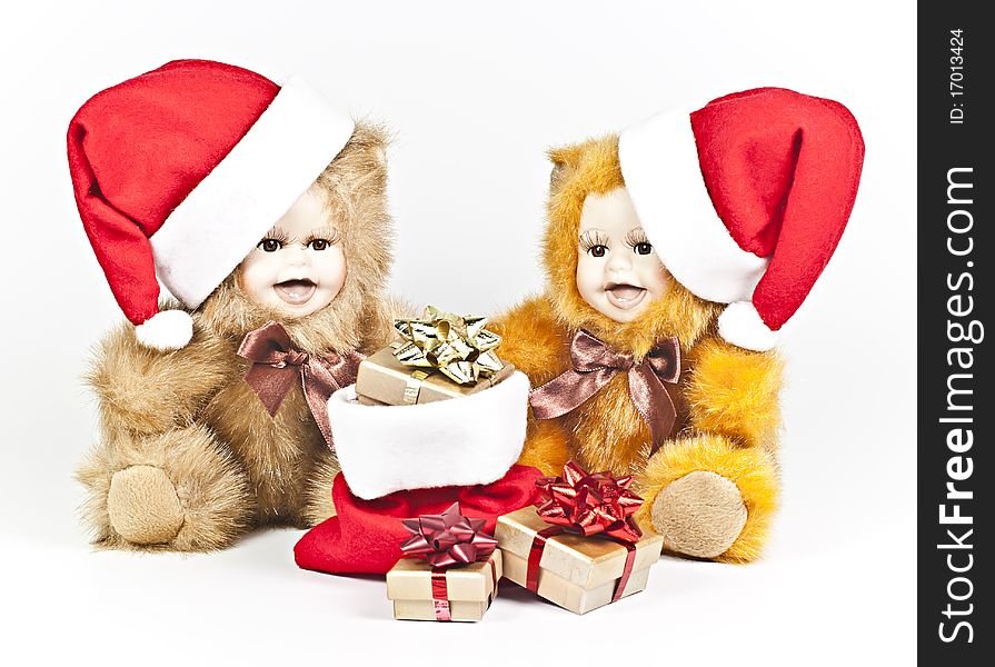 On a white background are two porcelain bears a Christmas gift bag. On a white background are two porcelain bears a Christmas gift bag.