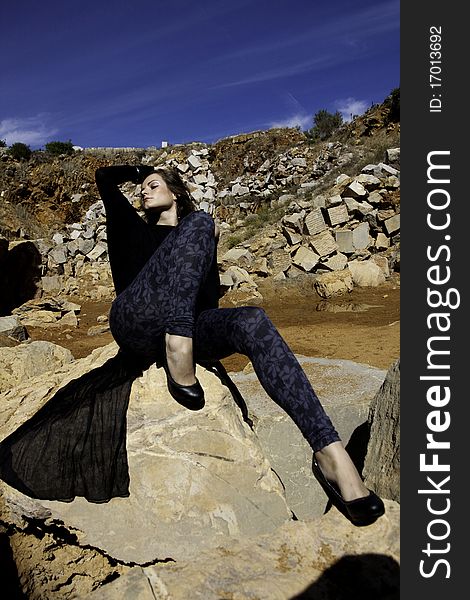 Woman Poses On A Stone Quarry