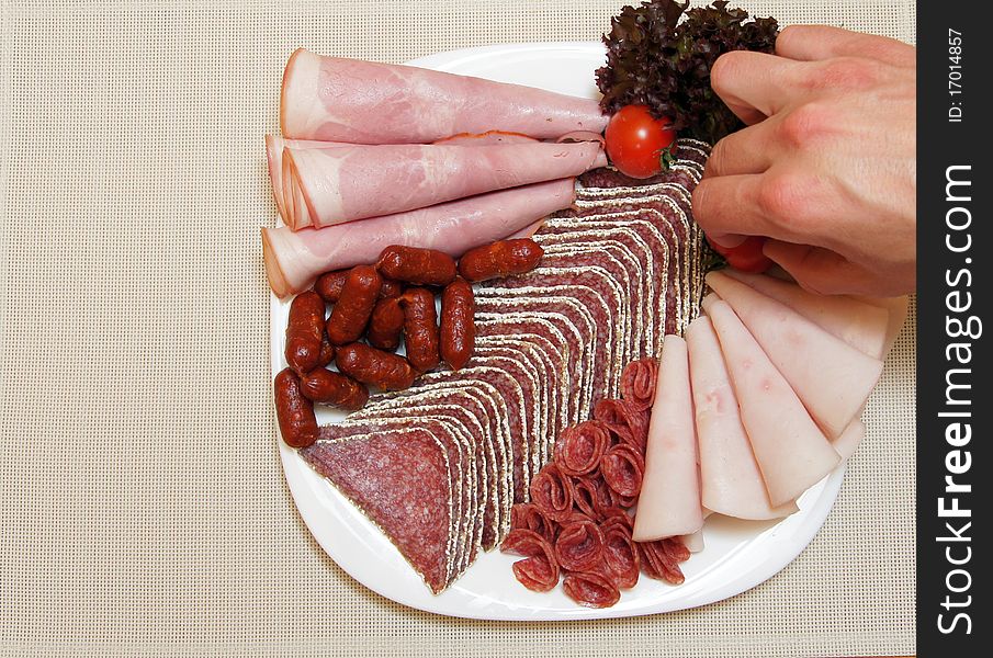 Food styling of Salami plate with vegetable