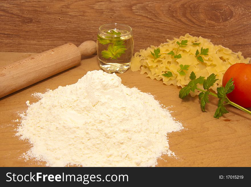 Nice fresh pasta ingredients on a board to knead dough