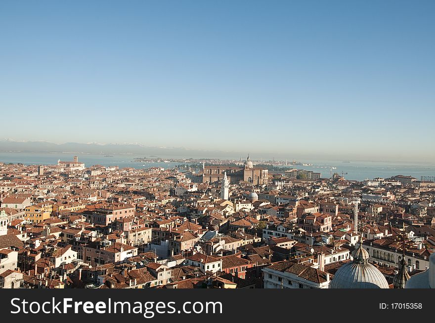Ariel view of Venice with snow capped mountains in background